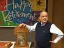 Outgoing COO Harold Kramer, WJ1B, speaks to ARRL staff members at his retirement party. The HQ staff gave him an antique clock. [Bob Inderbitzen, NQ1R, photo]